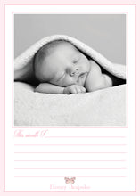 Load image into Gallery viewer, A newborn baby is peacefully sleeping, wrapped in a soft blanket, in a serene and intimate setting.