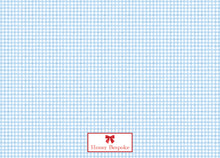 Load image into Gallery viewer, The image is a repeating pattern of blue and white checkered squares, with a small red bow in the bottom right corner.