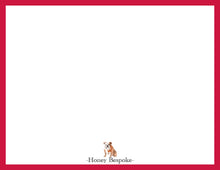 Load image into Gallery viewer, a small brown and white dog standing in the center of a red frame.