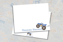 Load image into Gallery viewer, a white notepad with a blue and yellow monster truck illustration on it. The name "Thomas Hanson" is written in blue text below the truck.
