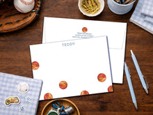 Load image into Gallery viewer, a desk with various items, including a baseball, a note card with a basketball design, a baseball glove, a bowl of pens, and a small bowl with a baseball.

