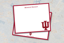 Load image into Gallery viewer, a white square note card with a red border, placed on a patterned fabric background.
