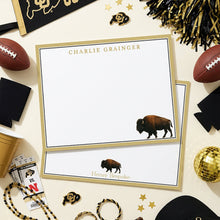 Load image into Gallery viewer, a table topped with a football, sunglasses and other items
