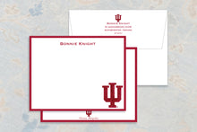 Load image into Gallery viewer, a set of red and white stationery items, including a white envelope and a red notepad. The envelope has a personalized address and a university logo, while the notepad has a blank space for writing.
