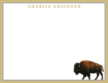 Load image into Gallery viewer, A large buffalo with a brown coat and prominent horns is depicted in the image.
