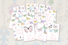Load image into Gallery viewer, a collection of cards or books with illustrations of butterflies on them, each with a different number of months. The cards are arranged in a way that suggests they are part of a series or collection.
